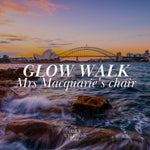 Sunset over Sydney Harbour with 'Glow Walk Mrs Macquarie's Chair' text overlay.