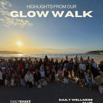 Group of people on a beach with sunset, text 'Highlights from our Glow Walk' and 'Daily Shake Daily Wellness Club'.