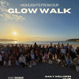 Group of people on a beach with sunset, text 'Highlights from our Glow Walk' and 'Daily Shake Daily Wellness Club'.