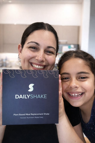 Busy mum and daughter having daily shake 
